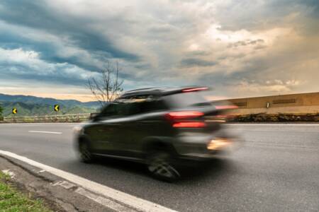 Mobile speed cameras with warning signs blown over