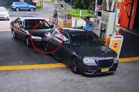 ‘Whoops’ – CCTV shows driver crashing into police car at servo